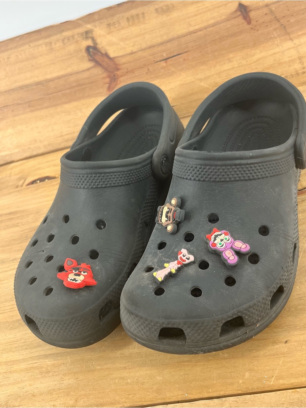 CROCS Kids Black Slip-On Clogs with Colorful Charm Accents